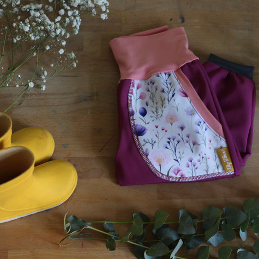 Purple softshell trousers, white flowers