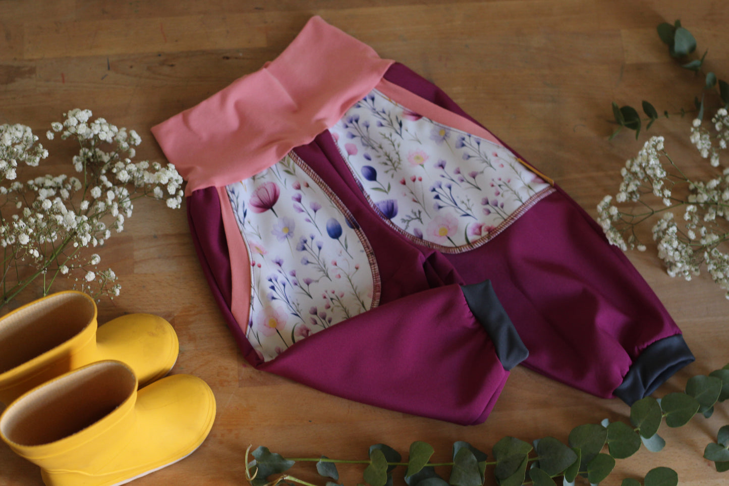 Purple softshell trousers, white flowers